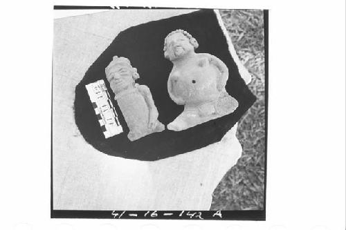 Two Seated Ceramic Female Figurines