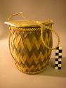 Small twilled basketry cylinder with black and white pattern