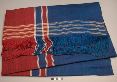 Textile; maroon, blue, w/ gold stripes.