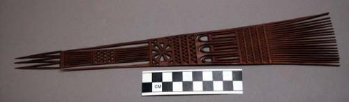 Wooden comb, finely carved, flaring tines, openwork geometric designs, flat