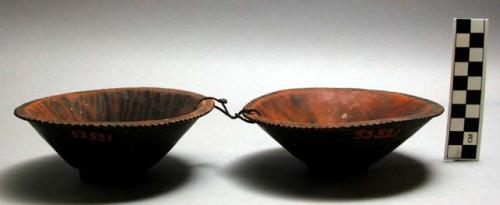 Wooden bowls joined with cord