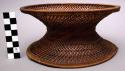 "Monks" begging bowl of iron with rattan cover and stand 9" high
