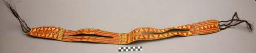 Wide basketry belt with slit at sides--brown with red and yellow design