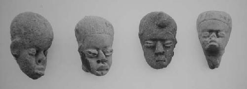 Figurine heads (4), red-brown, unslipped.