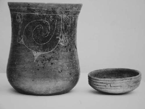 Black brown fine-incised cylinder and vase; coarse incised small bowl.