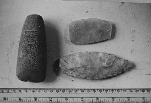 Ground stone axe head and two chipped flint artifacts