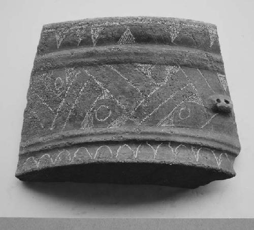 Black brown, fine incised vessel with flaring wall and flat base