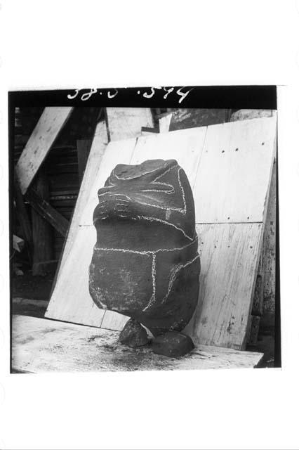 Stone torso with arms (Front & left side - carving outlined with chalk).