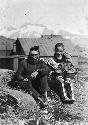 Couple Seated on Grass With Baby