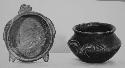 Shallow animal effigy Bowl (A); Polished black vessel with animal head (B)