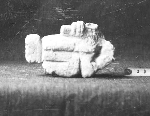 Str. Q-156. Small sculpture in debris on altar cat #54-43. left side