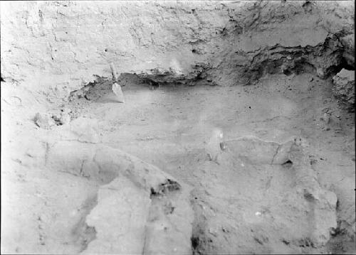 Floor 3 extending under East wall -- Cist 2, wall