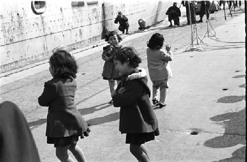 four girls playing on docks