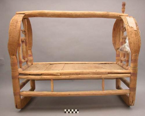 Cradle (?); wooden.