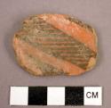 Pottery sherd; White and black linear design:n