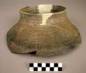 Ceramic rim sherd, corrugated around neck, heavily mended