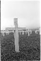 Cemetary with white crosses for gravemarkers