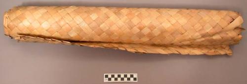 Mat, woven reed, rectangular, plain, rolled