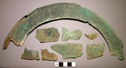 Vessel and helmet brim fragments