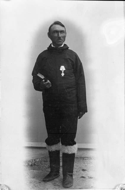 Man With Medal and Book