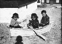 Three Children in Tiny Boat