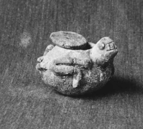 Miniature turtle effigy vessel with disc cover. - vessel contains ashes.