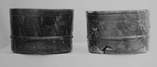 Black-brown fine incised cylinders (2)