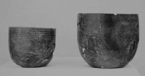 Black-brown "goblet"-type vessels (2), fine incised.