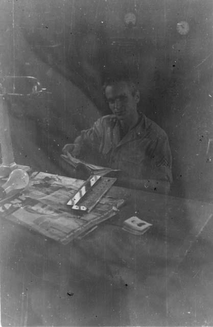 Man reading at desk