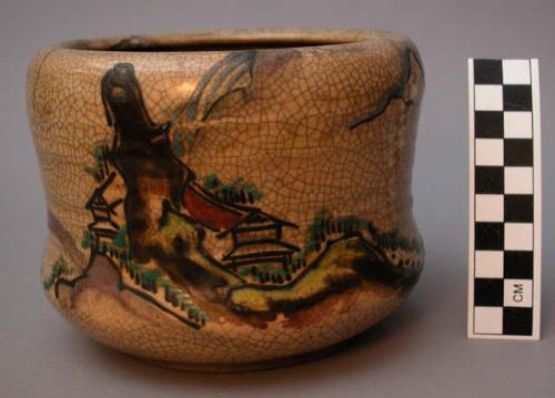 Ceramic jar with painted landscape