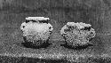 2 miniature vessels - coarse light brown ware.