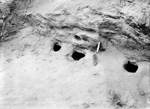 Storage holes under ledge in South wall, room 3