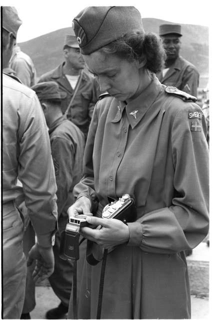 female soldier looking at a watch