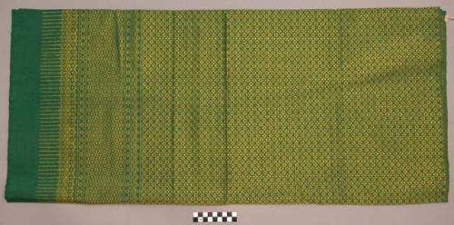 Fine green cotton pasin or skirt with an all-over pattern