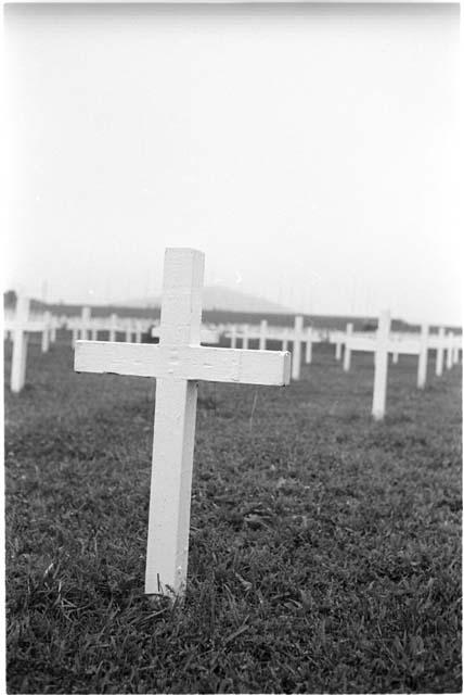 Cemetary with white crosses for gravemarkers