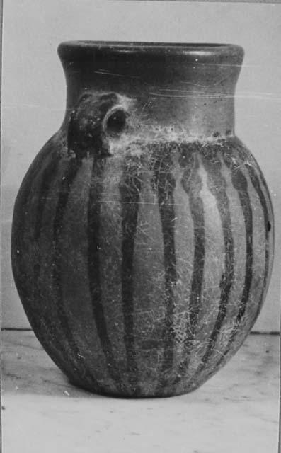 Pottery vessel with handles