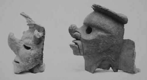 Human heads with upturned noses, pottery