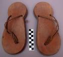 Pair of wooden clogs with toe-thongs