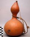 Water gourd with a wooden stopper and a cord