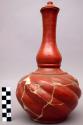 Red burnished water carafe and lid