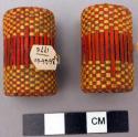 Pair of red and yellow basketry ear plugs