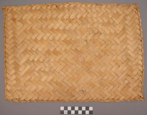 Mat woven from inside strips of bamboo. used also on floors of houses +