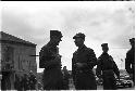 Two men in military uniform talking