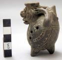 Ocarina with incised decoration; grotesque animal form