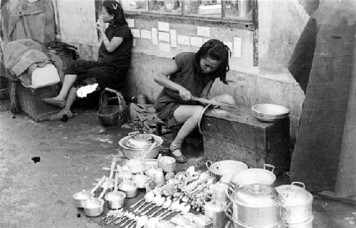 Woman working on pan