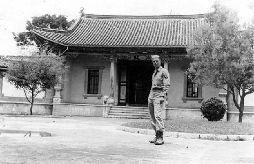 Man in front of building