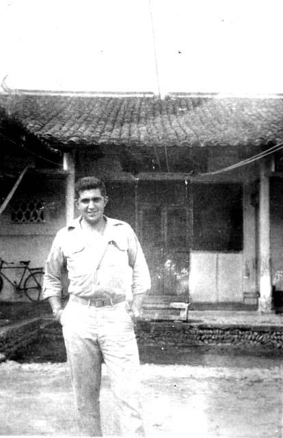 Man in front of house