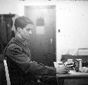 Soldier writing at desk