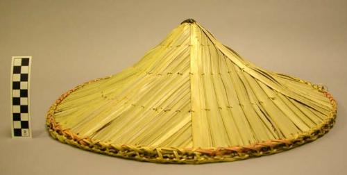 Hat of plantain leaves, bamboo finial