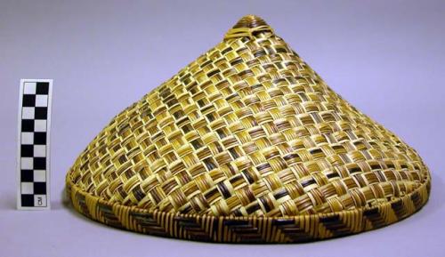 Woven hat with repeating horizontal line design